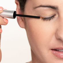 Load image into Gallery viewer, Woman applying Obagi Nu-Cil Eyelash Enhancing Serum