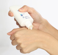 Load image into Gallery viewer, Woman applying Obagi Clear Fx by hoodermatology.com