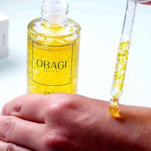Person applying Obagi Daily Hydrodrops by hoodermatology.com